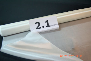 2.1 osy Fiberglass Cloth style 112 538 finish from Thayercraft 112 folded over open roll layed out on table