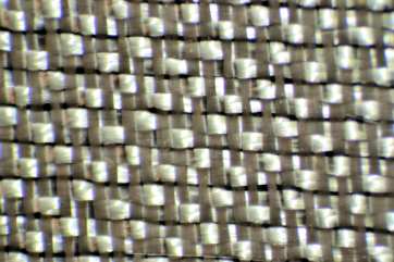 Closer view 4 harness satin weave style 120 Fiberglass Cloth Thayercraft 120 3.16 oz/sq yd 4 harness satin weave fiberglass cloth Microscope