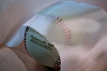 Style 1280, 1.6 oz/sq yd fiberglass cloth shaped around baseball