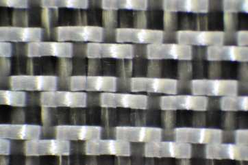 Closer view 4 harness satin weave style 1543 Fiberglass Cloth from Thayercraft 1543 4 harness satin weave fiberglass cloth microscopic close up