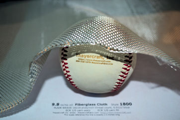 Style 1800 fiberglass cloth Style 1800 fiberglass cloth shaped around baseball
