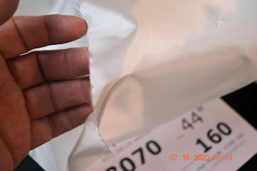 3070 2.74 osy 70x70 fiberglass cloth close up My hand with 3070 tight weave fiberglass cloth