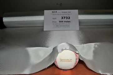 12.4 oz/sq yd style 3732 fiberglass cloth shaped around baseball