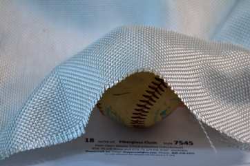 Style 7545 18 oz Fiberglass Cloth showing drape on baseball  from Thayercraft