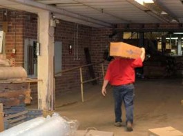 Steve Thayer, president of Thayercraft carrying roll of cloth up ramp 5s Steve Thayer, president of Thayercraft carrying roll of cloth up ramp 5s