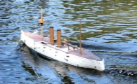 Fiberglass model ship in water with power